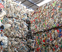  Thousands of returned bottles and containers compacted at a recycling facility
