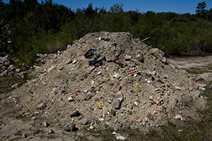 Illegally dumped waste, brick, rocks, rubble, construction site rubbish