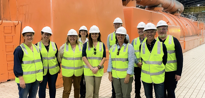 The board and executive team in hi viz and helmets at the Vales Park power station