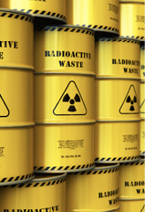 yellow barrels marked Radioactive waste and the radioactive symbol 