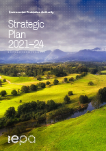 cover if the strategic plan showing tree studded grassland with mountains in the distance