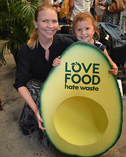 mother and daughter with Love food hate waste sign