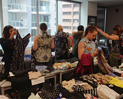 epa staff finding new outfits at the clothes swap