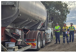 police and EPA staff inspecting a tanker