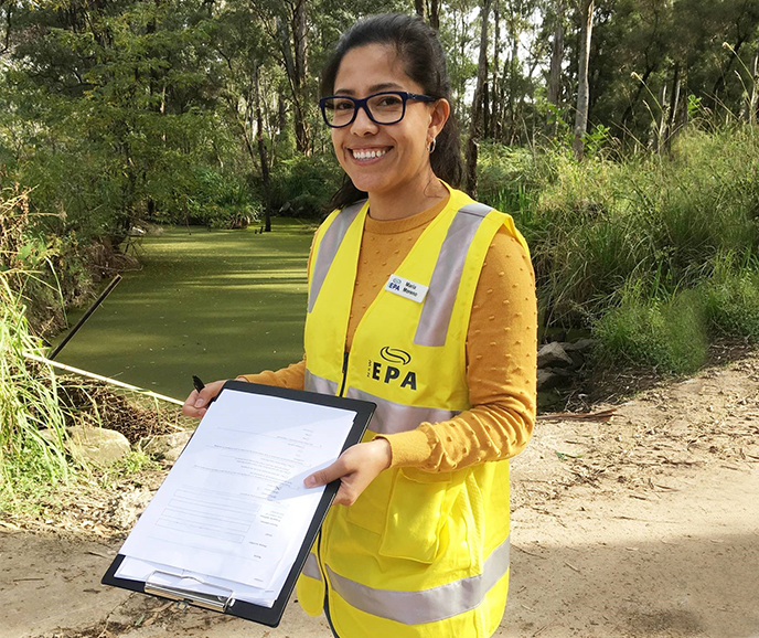 woman holding a clipboard conducting a water use survey