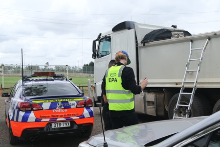 EPA officer working with police to inspect truck