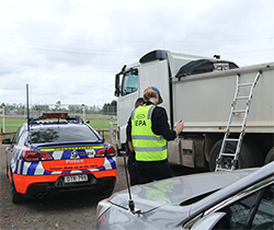 EPA officer working with police to inspect truck