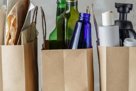 bottles, plastic containers and paper for recycling