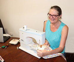 woman using a sewing machine