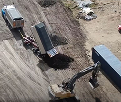 aerial shot of truck illegally dumping waste