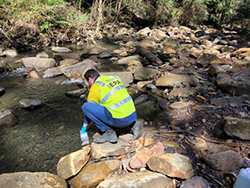 EPA officer sampling water at Camp Gully Creek