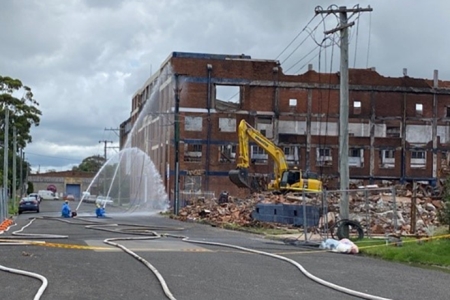 site of Wickham wool store fire with asbestos containment