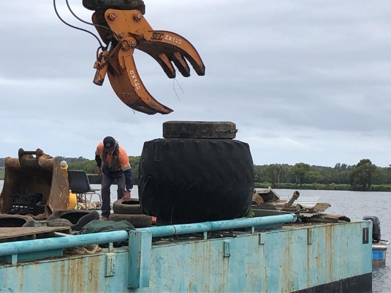 Removal of tyres from Dumaresq Island