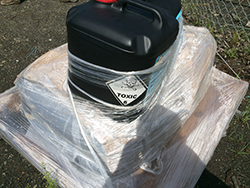 Toxic chemicals in a drum on plastic wrapping