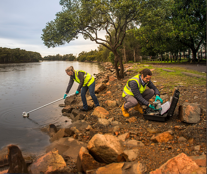 EPA officers sampling water in a river