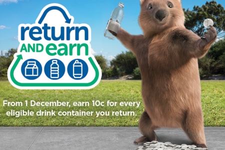 Ernie the wombat with a recyclable bottle and coins