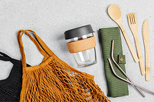 Set of eco-friendly bamboo cutlery, eco bag and reusable coffee mug