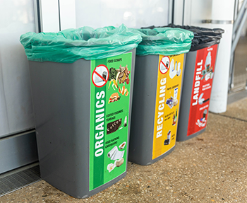 bins with large stickers explain what goes in them