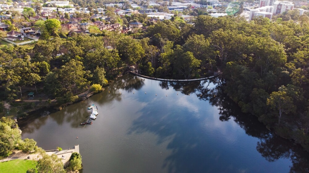Aerial view of small lake with boats on it