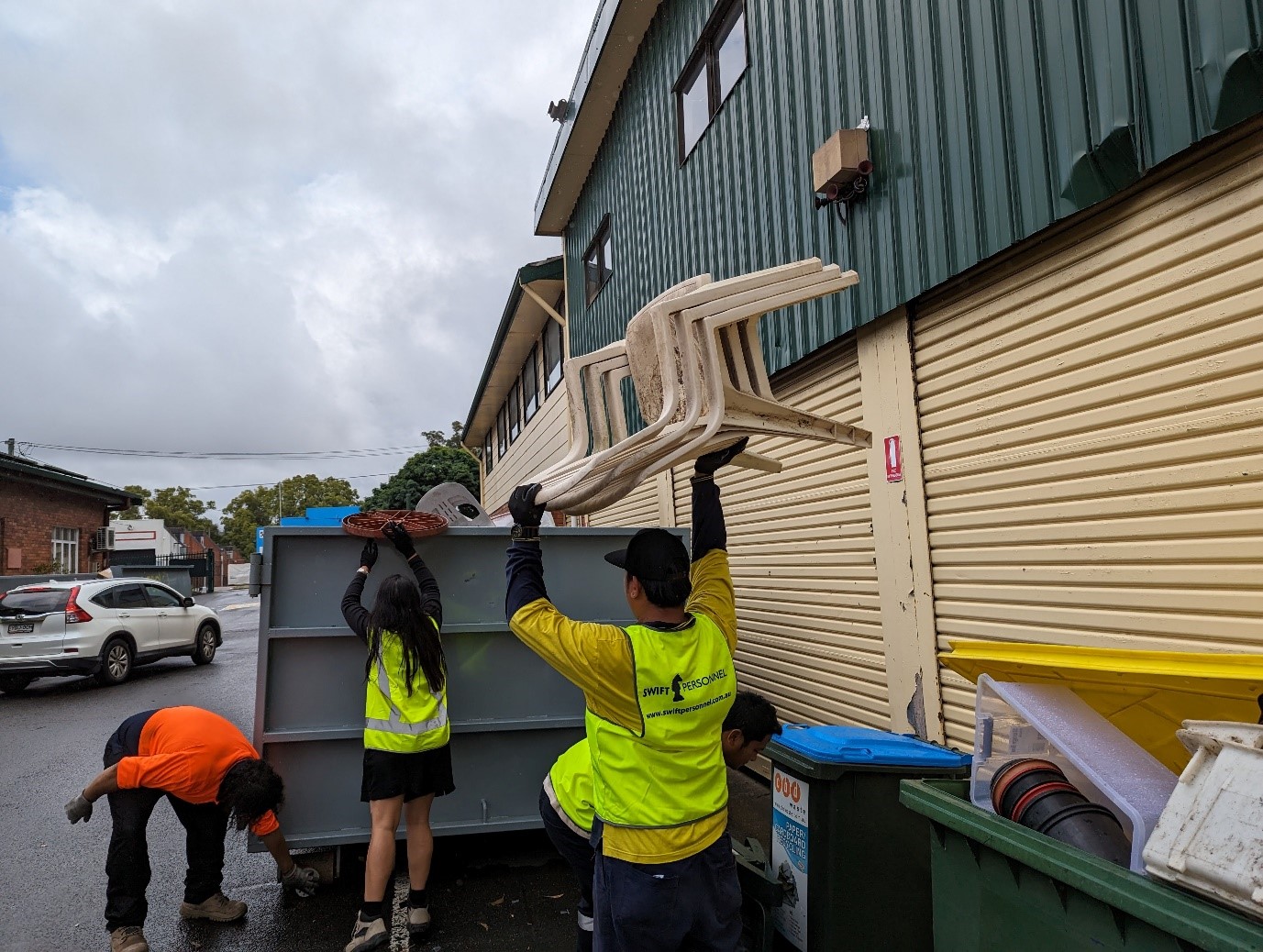 Georges River Council event staff sort hard-to-recycle items dropped off by residents into bins for recycling. Credit: Georges River Council