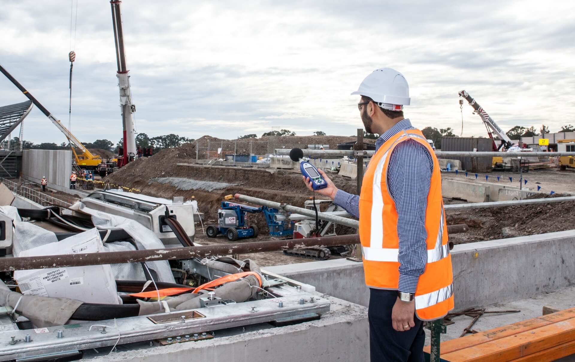 EPA officer conducting noise level inspection