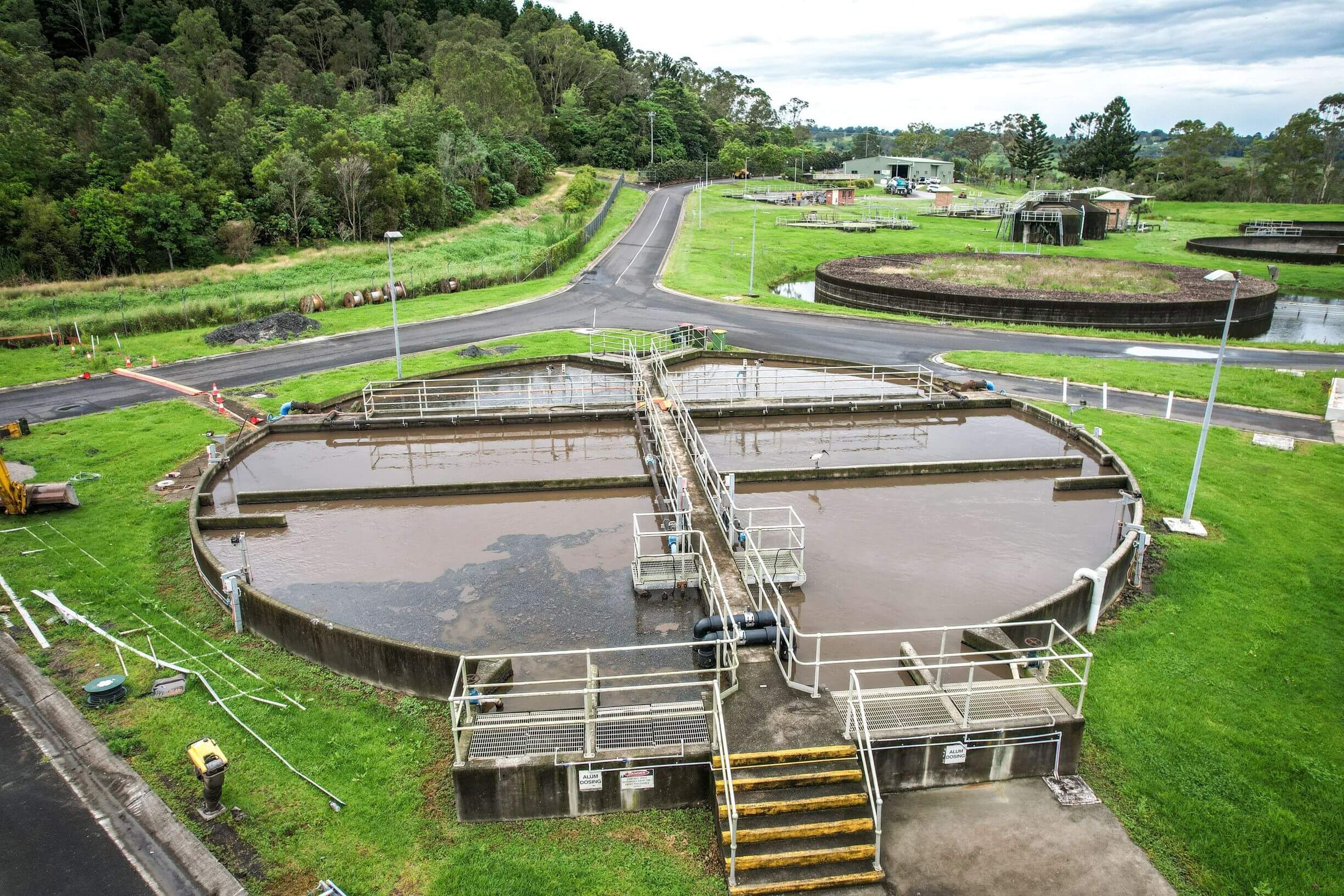waste treatment tank at a treatment facility with green grass adjoining