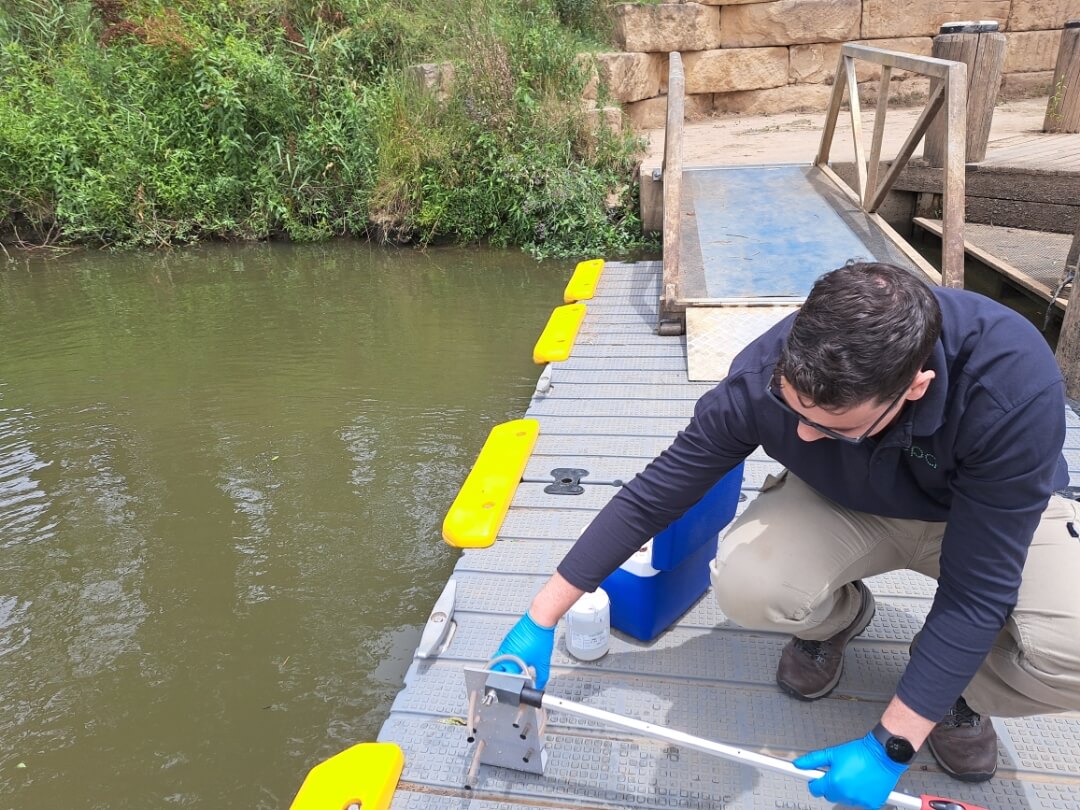 EPA officer sampling water after the fire at North St Marys. Credit: EPA
